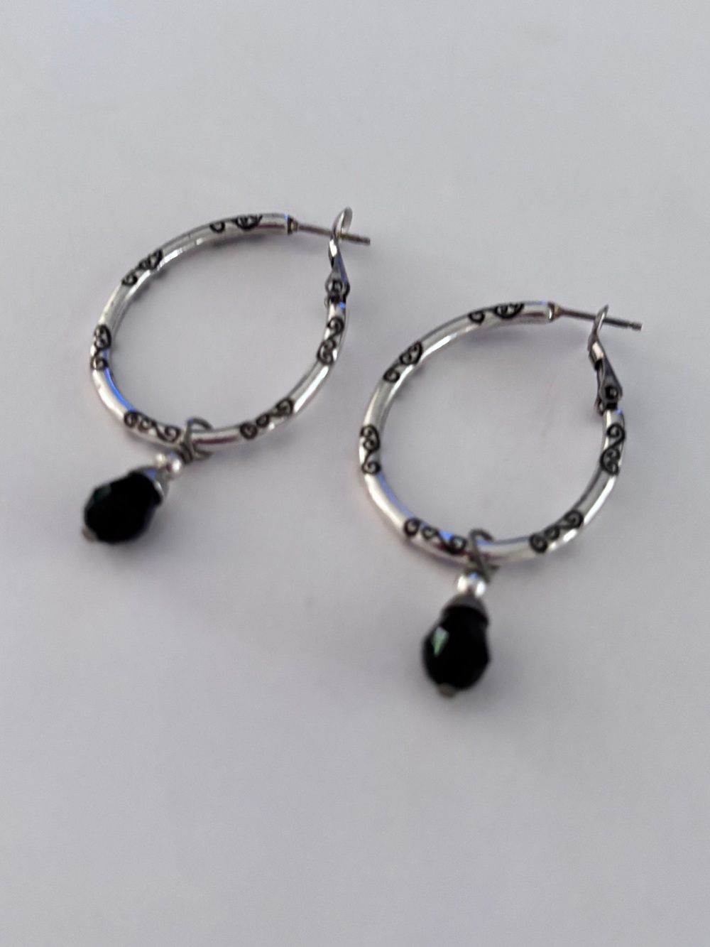 Brighton Collectibles Charm Hoop Earrings with dangling faceted black crystals